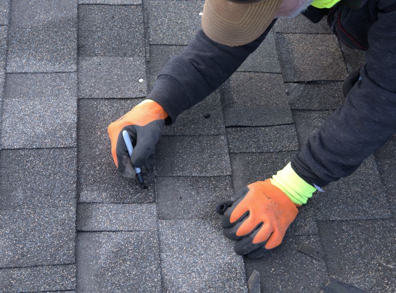 Completed asphalt shingle repair